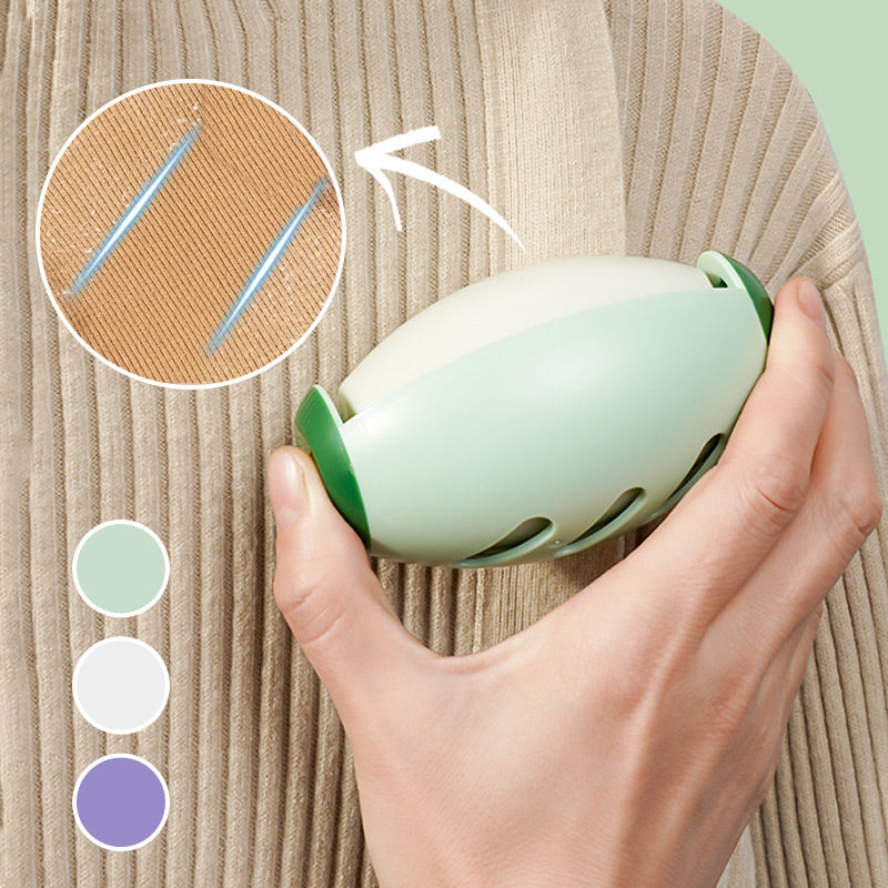 A hand rolling the green pet hair roller over a knit jumper, with a close-up of lifted hairs