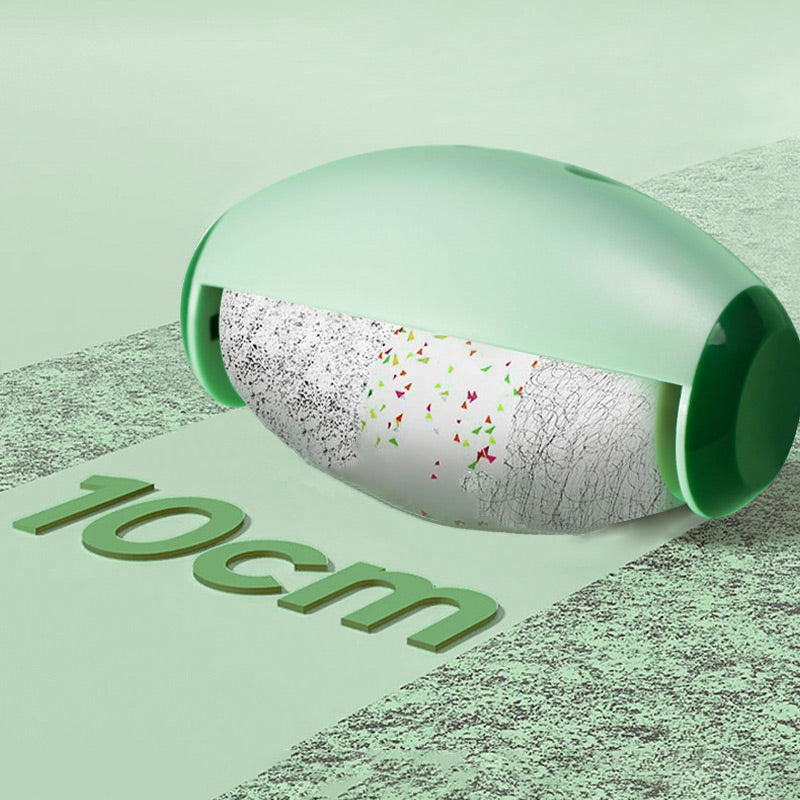 Green pet hair roller on a patterned rug beside a large 10 cm size mark