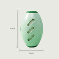 Green egg-shaped pet hair roller standing upright, 10.1 cm tall and 6.5 cm wide