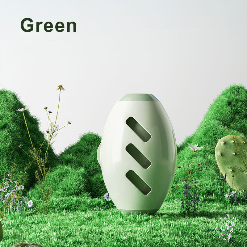 Green pet hair roller standing on grass, labelled Green