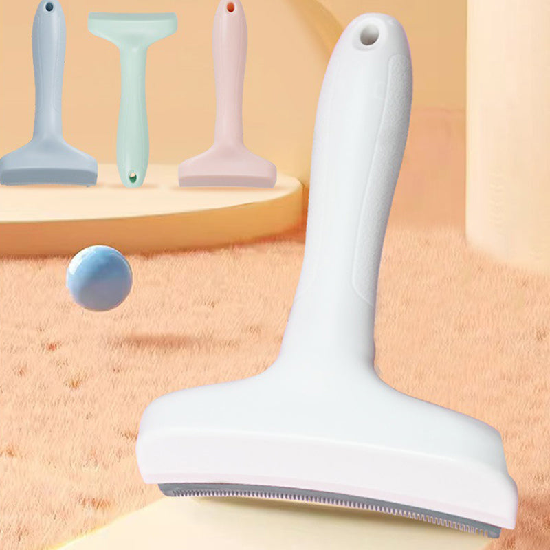 White deshedding comb with a curved steel blade, blue, green and pink combs behind it