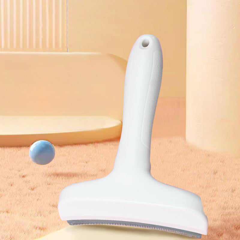 The white deshedding comb standing on its blade