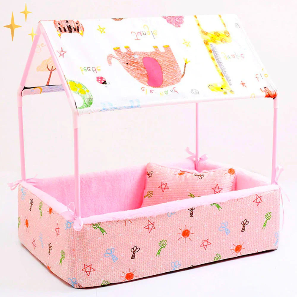 Pink fleece dog bed with a cartoon-animal canopy roof on a pink frame and a printed cushion inside