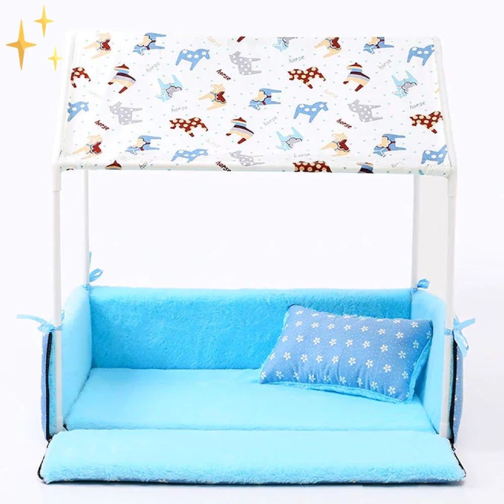 Light blue fleece dog bed with a dog-print canopy roof and a star-print cushion, the front folded down as a mat