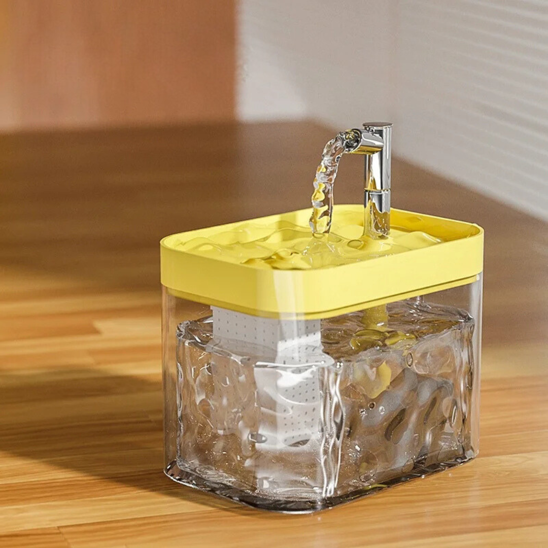 Pet water fountain with a clear wave-pattern tank and a yellow top tray